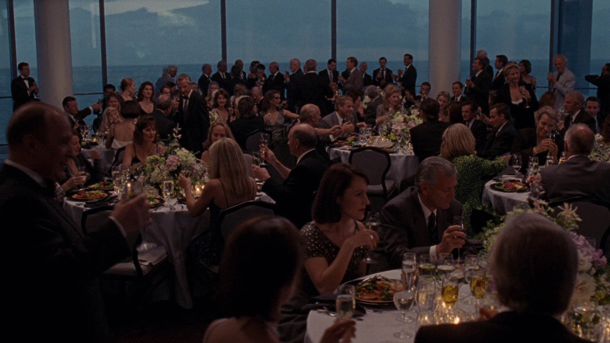 Evening reception at Saltwind & Cedar — guests, champagne, ocean view